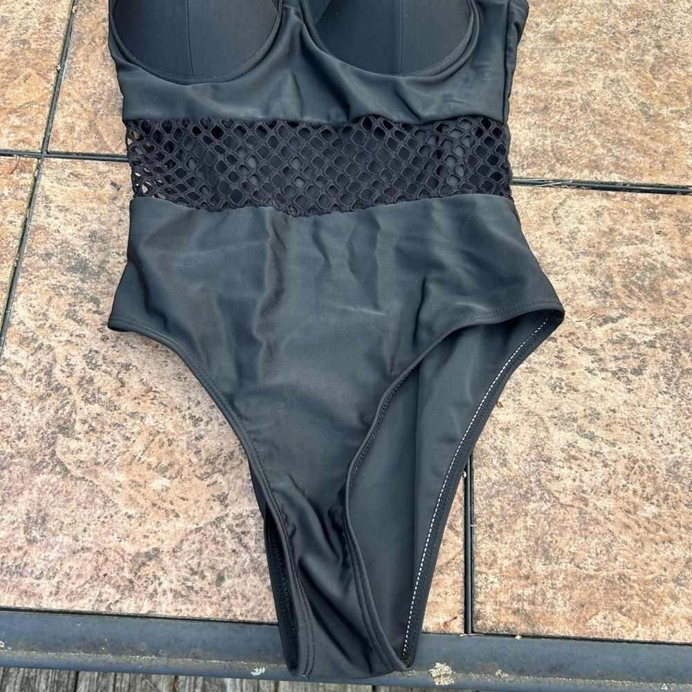 Sleek Black One-Piece Swimsuit with Lace Detail